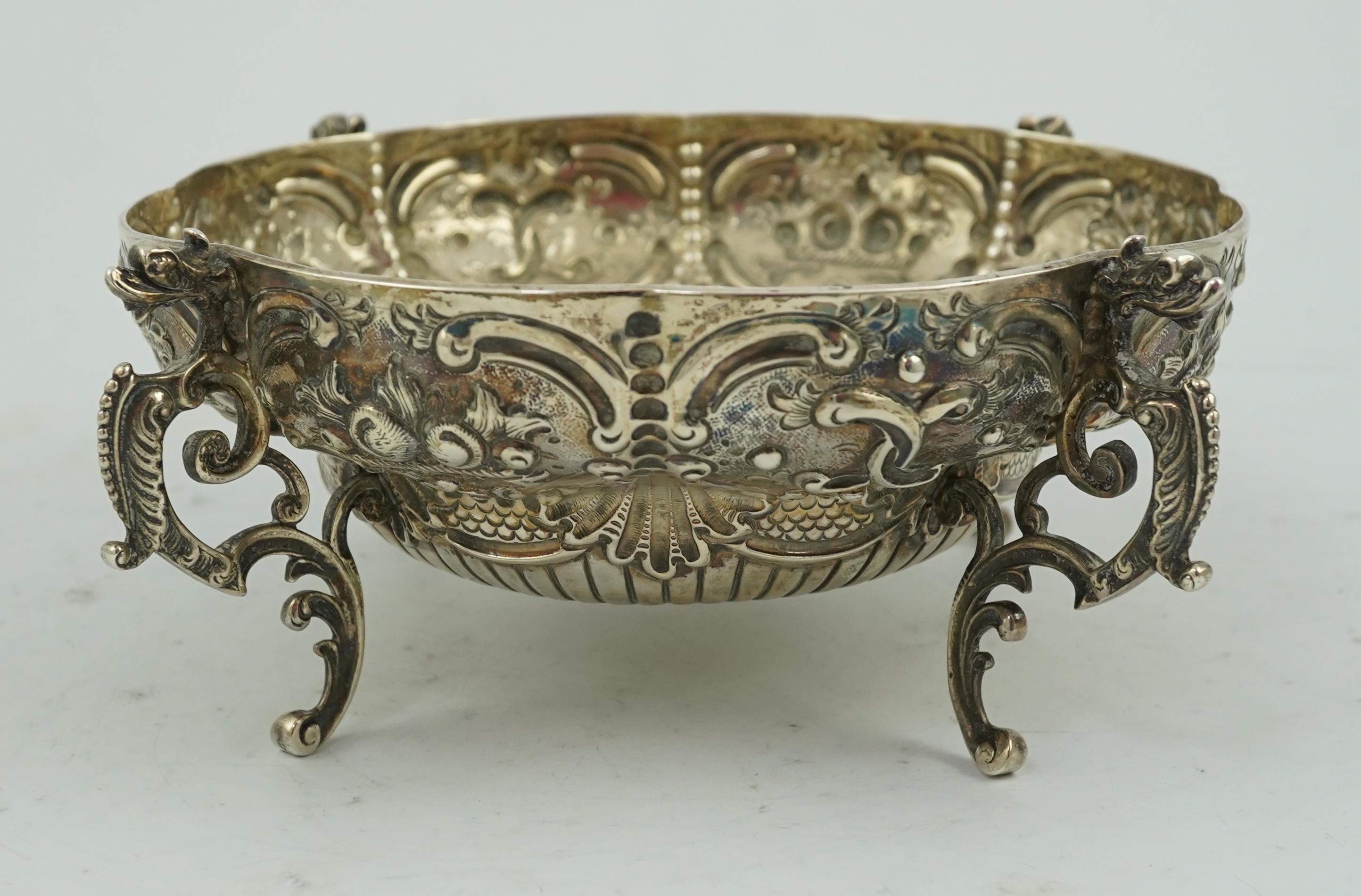 A late Victorian embossed lobed silver bowl, by Goldsmiths & Silversmiths Co Ltd?